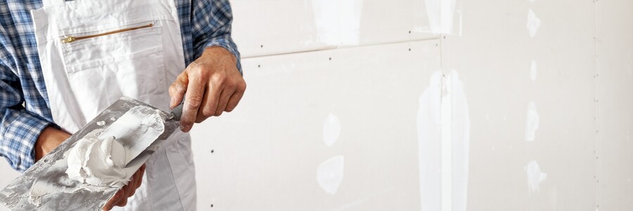 Drywall repair being performed by an experienced David Pro Craft Builders LLC drywall technician.